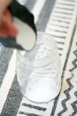 Adding sand to the bottom of a mason jar