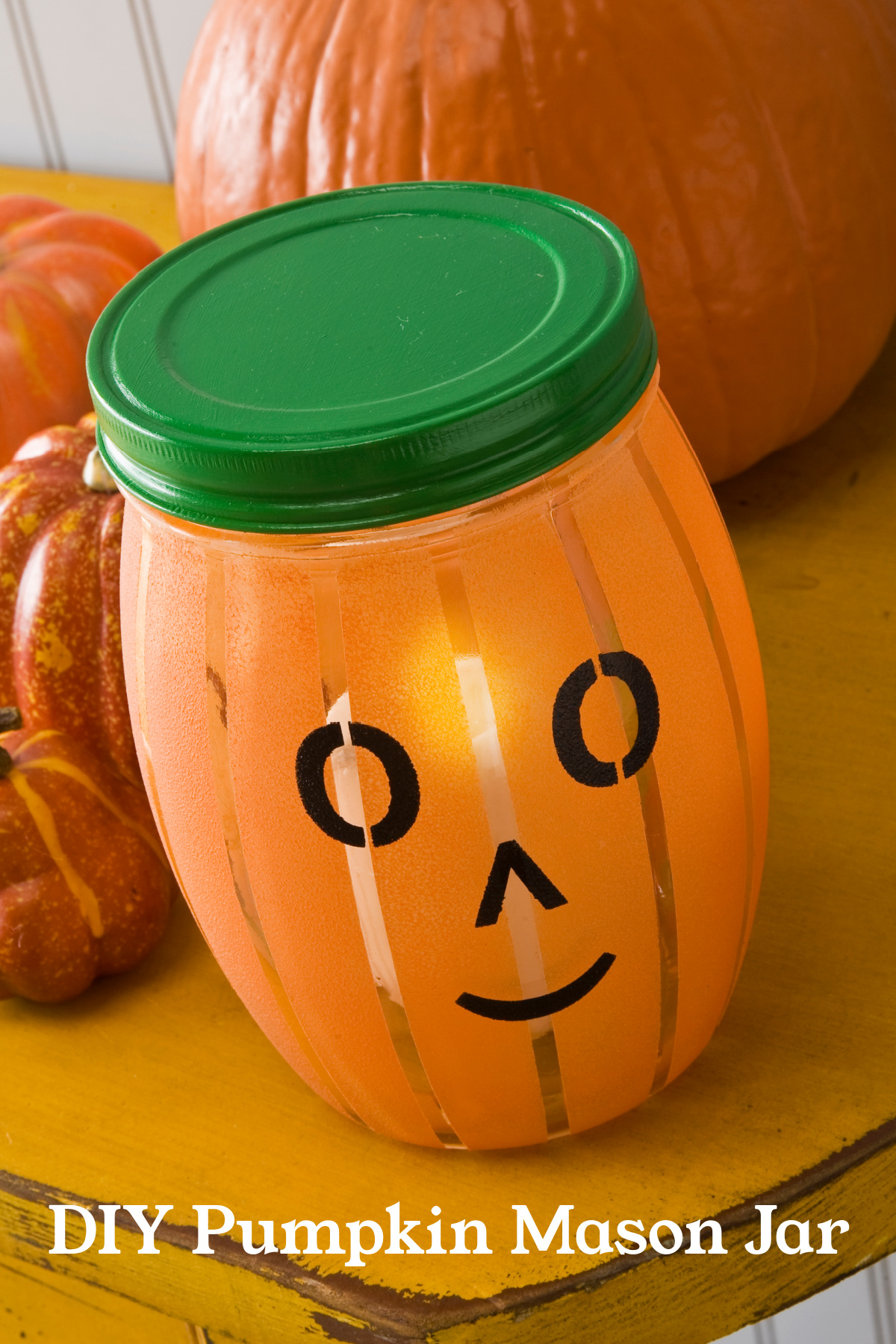 Pumpkin Mason Jar That Looks Like a Jack O' Lantern