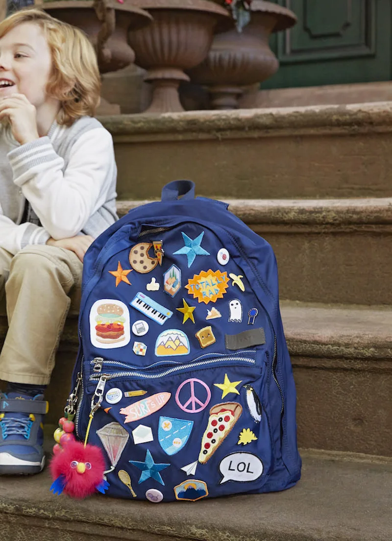 Blue backpack decorated with patches