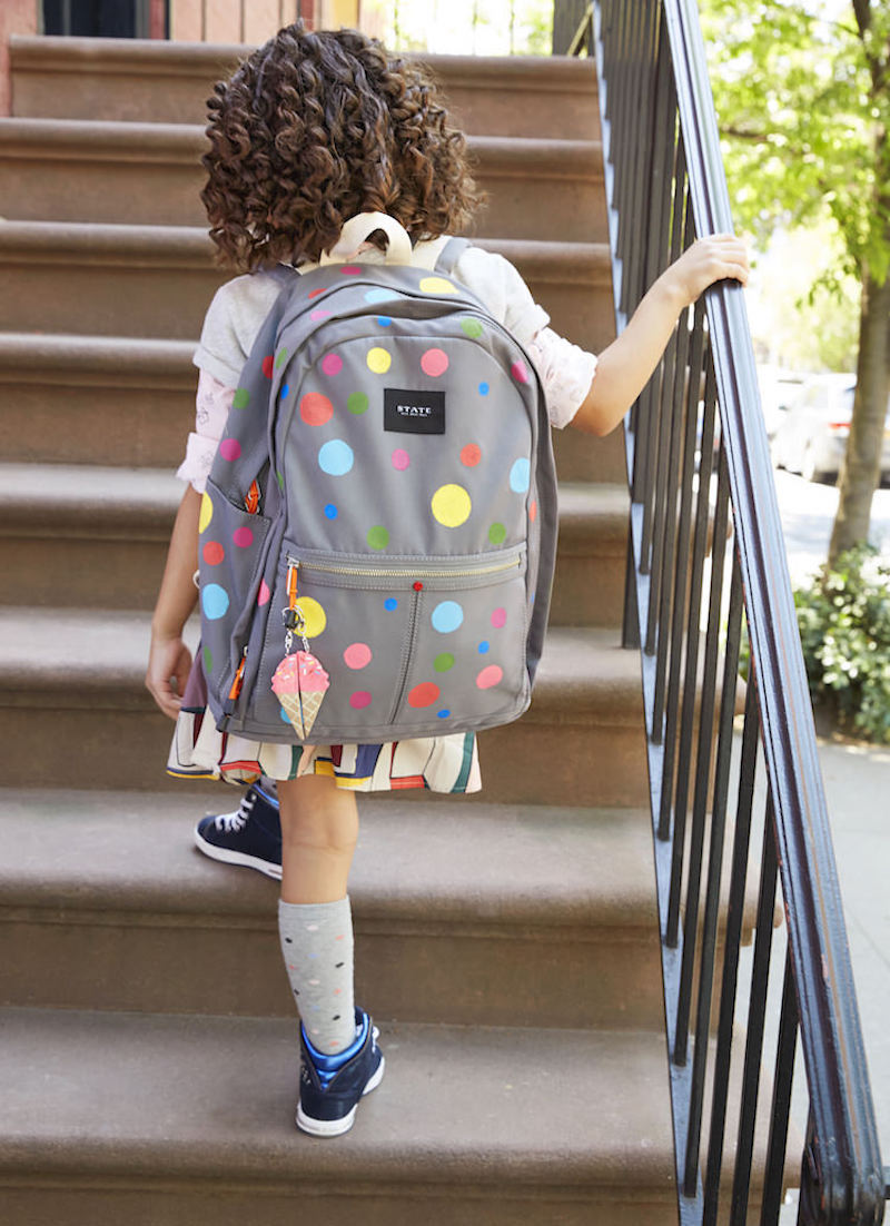 Gray backpack painted with polka dots
