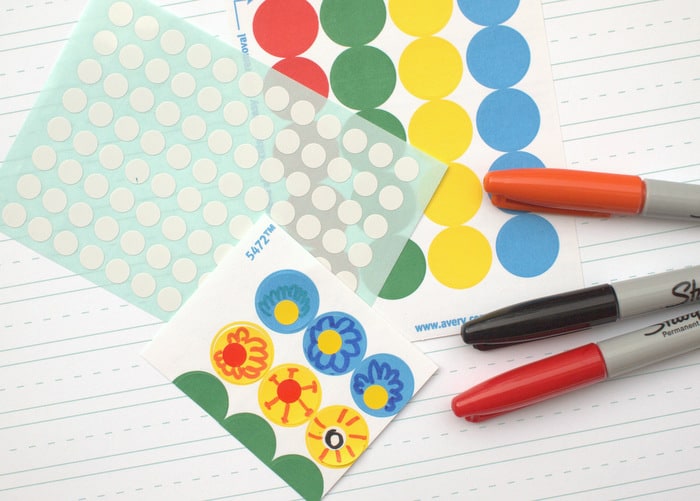 Office supply stickers, Sharpies, and stickers with Sharpie flowers drawn on them