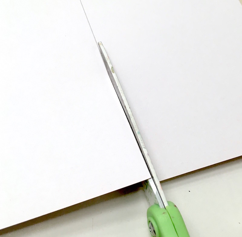 Cutting scrapbook paper with scissors