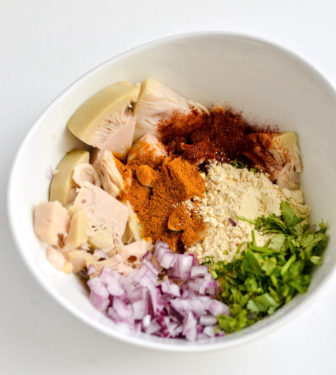 Boiled jackfruit in a bowl with onions and spices