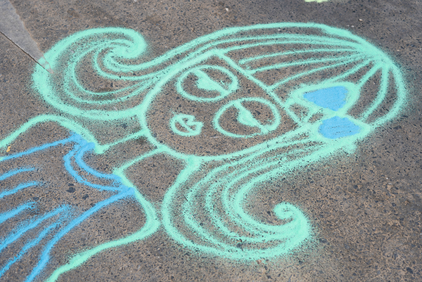 Drawing of a girl with sidewalk paint