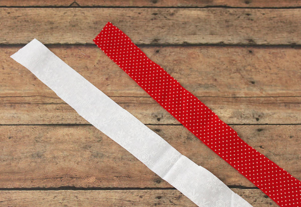 Strip of white fabric and strip of red fabric