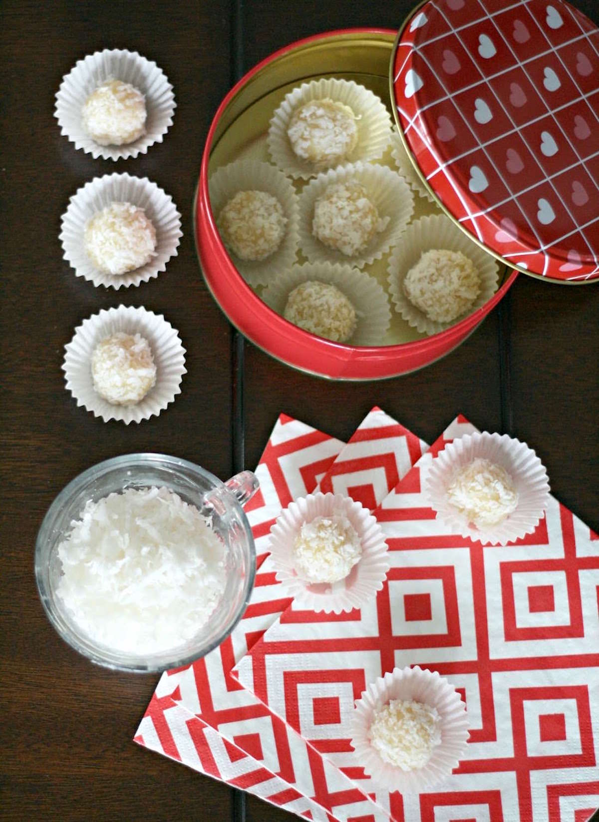 Brazilian coconut truffles in bonbon wrappers and in a tin container for gifting