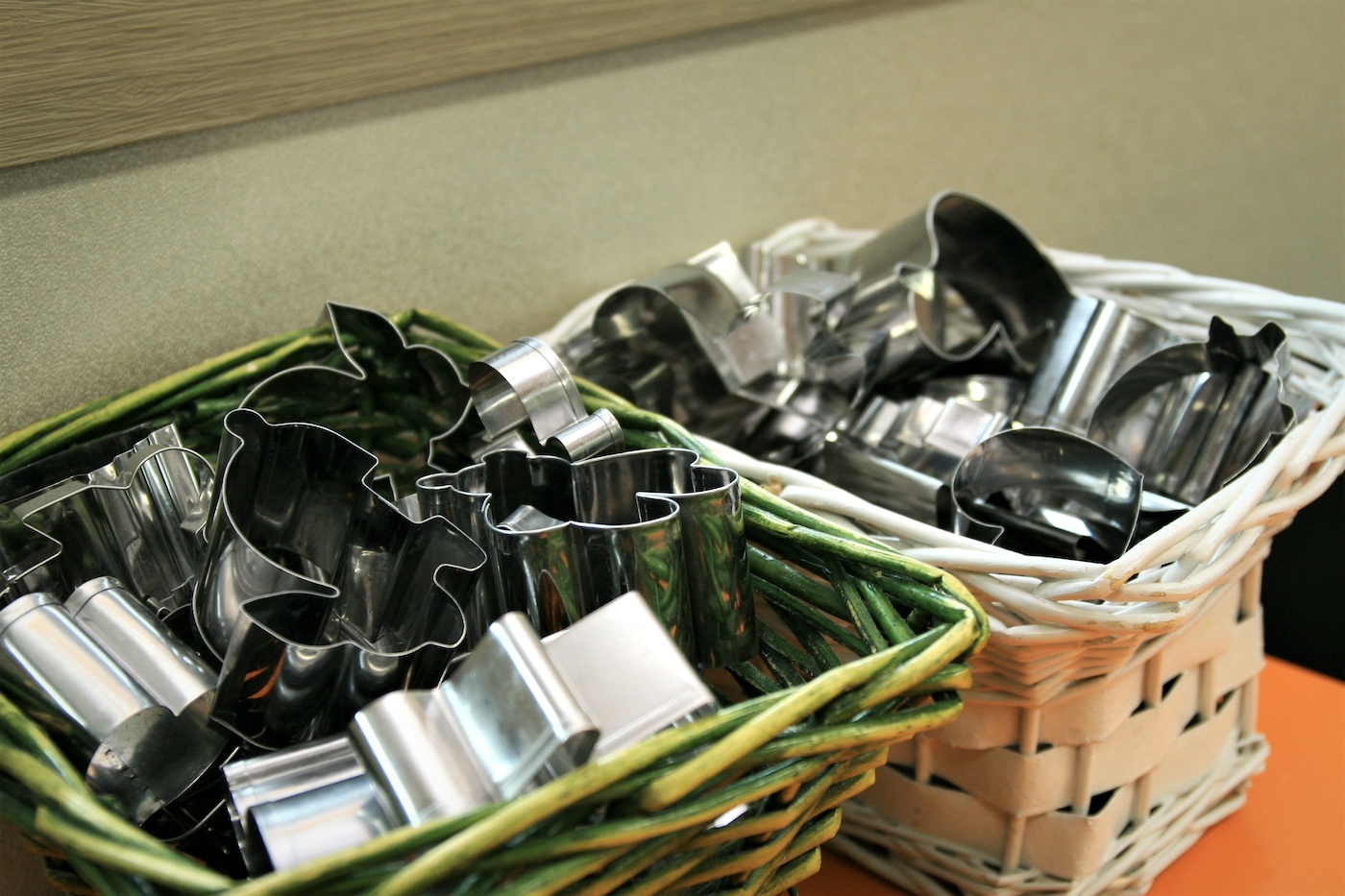 Collection of cookie cutters in two baskets