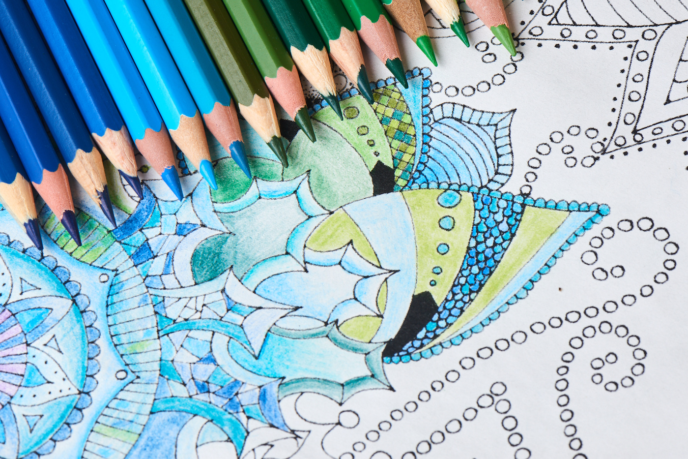 Coloring-page-with-blue-colored-pencils on top