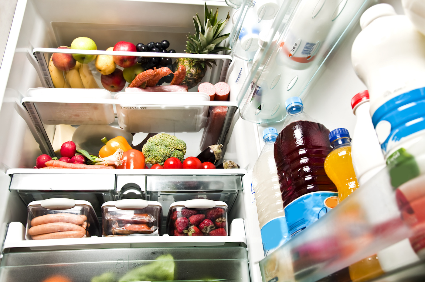 Open fridge stocked with food