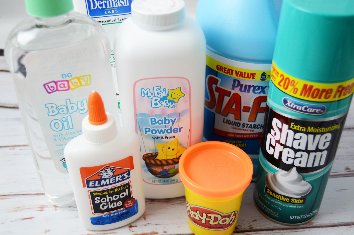 Elmer's Glue, baby powder, baby oil, Play Doh, liquid starch, and shaving cream
