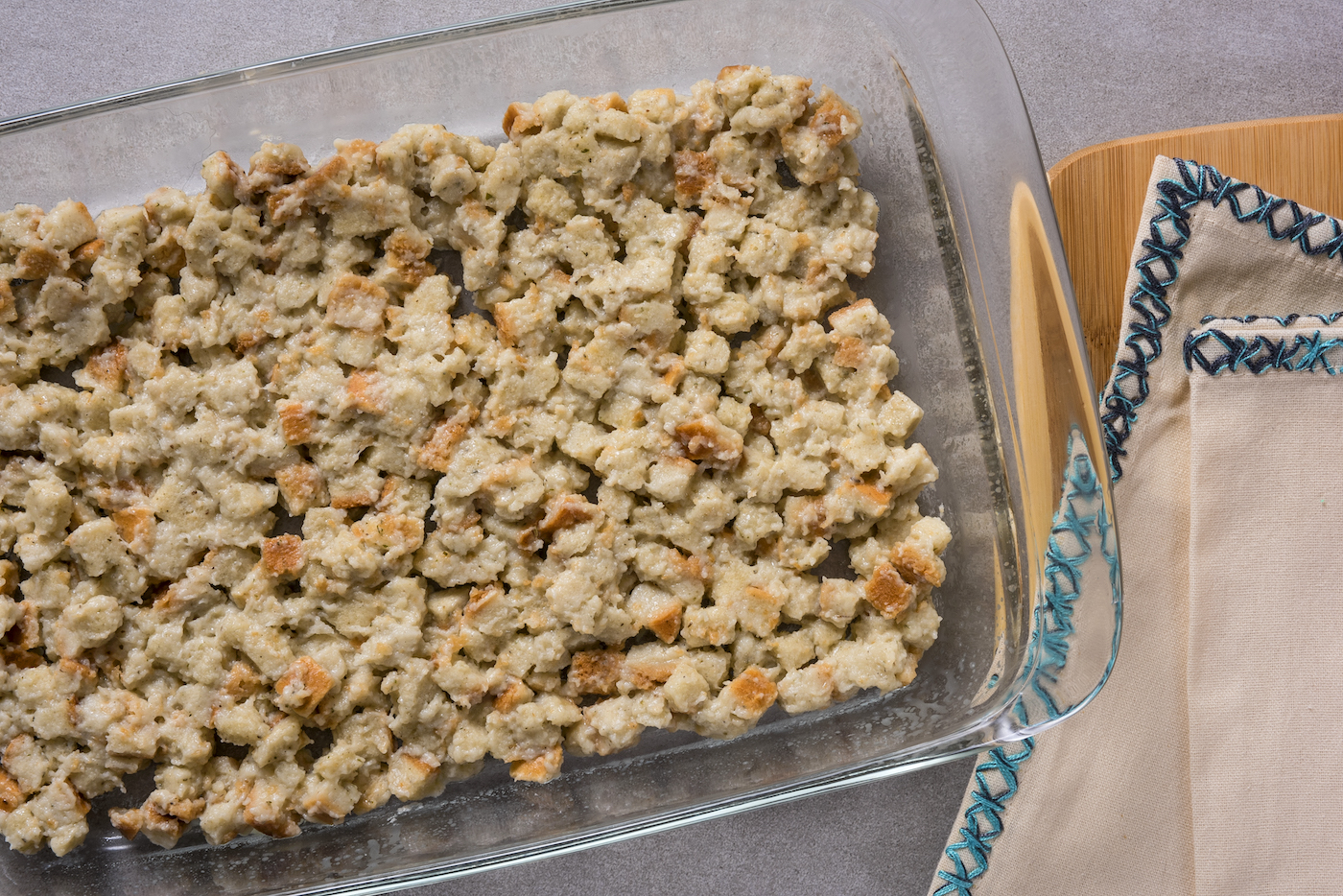 stuffing added to the bottom of a baking dish