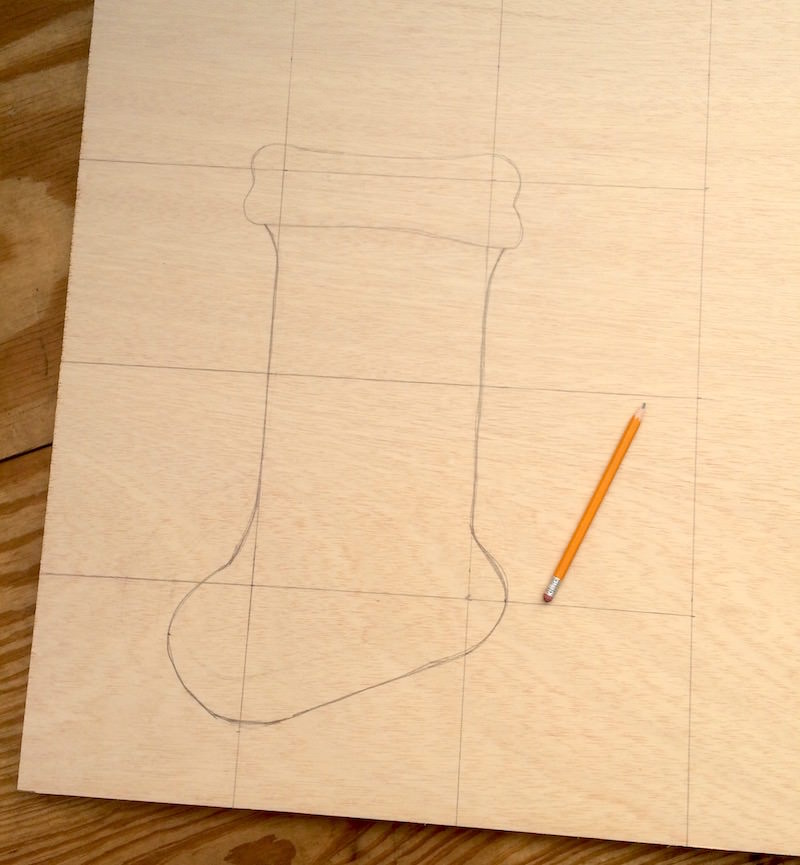 Hand drawing stocking shape with a pencil
