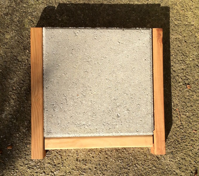 One side of a planter laying on the ground