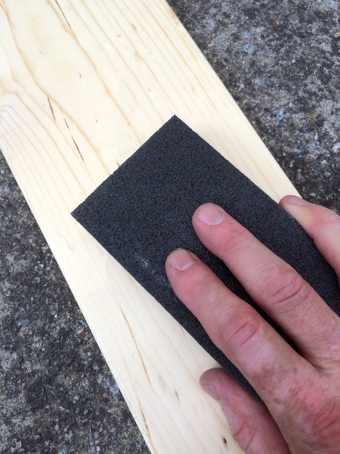 Sanding wood with a sanding block