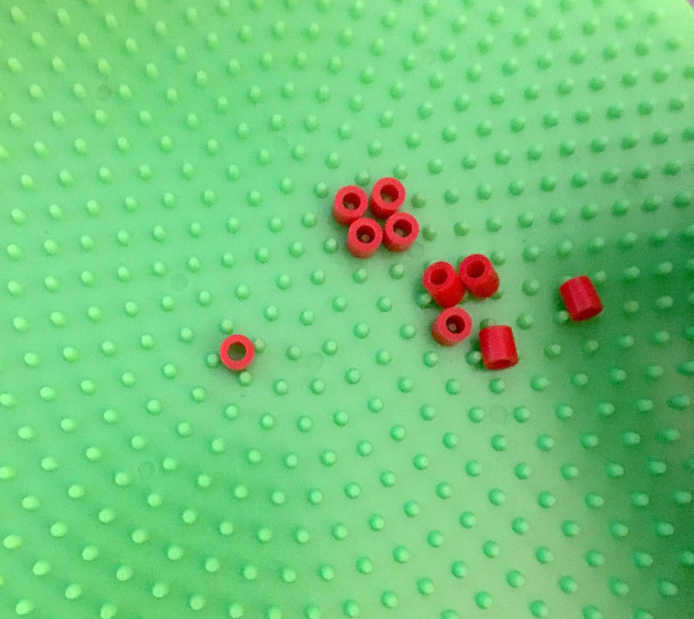 Perler beads on a round pegboard