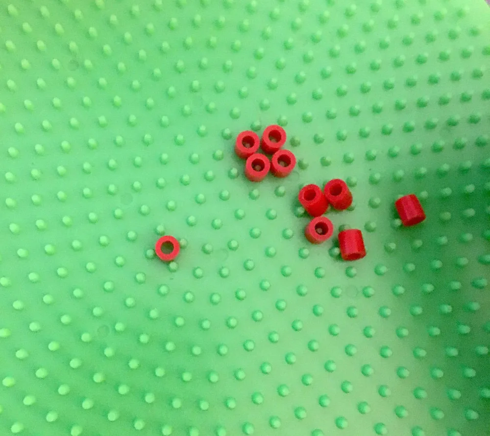Perler beads on a round pegboard