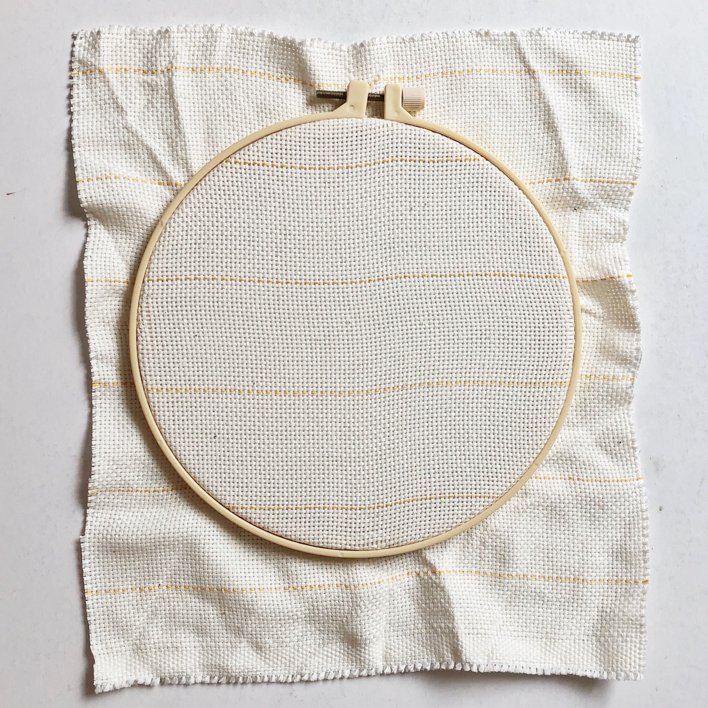 Cloth in an embroidery hoop