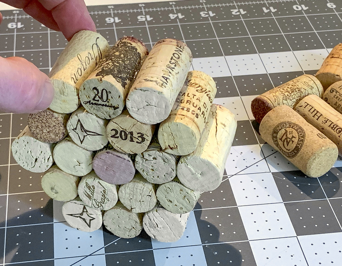 Creating a pumpkin shape by gluing wine corks
