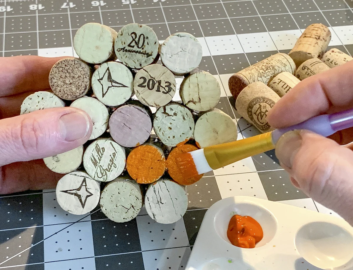 Painting the ends of the cork with acrylic paint