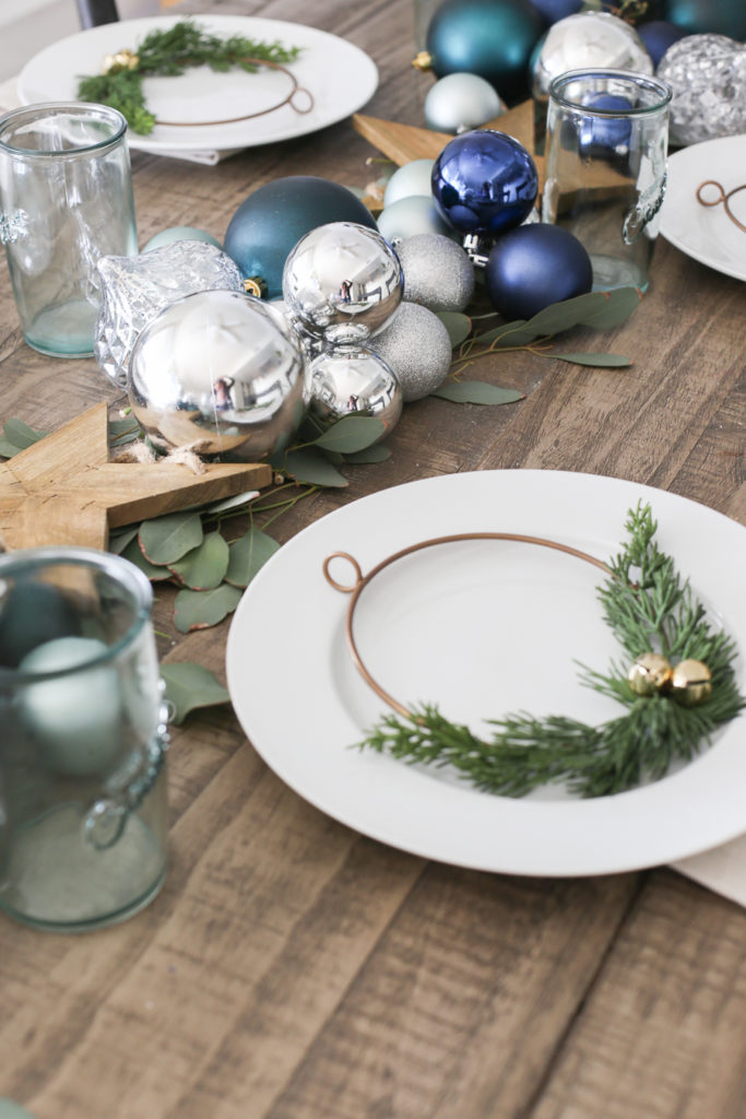 Pretty silver and blue Christmas tablescape with pine