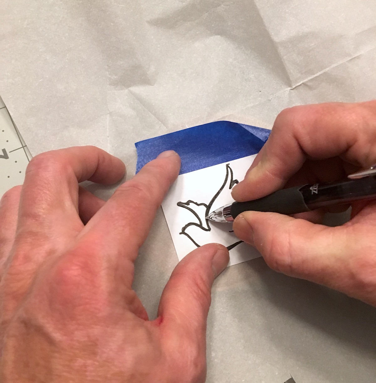 Tracing a dove design onto an ornament