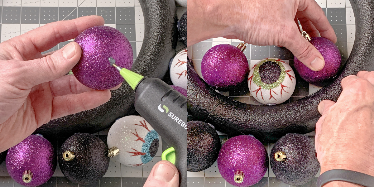 Adding more ornaments to a Halloween wreath with hot glue