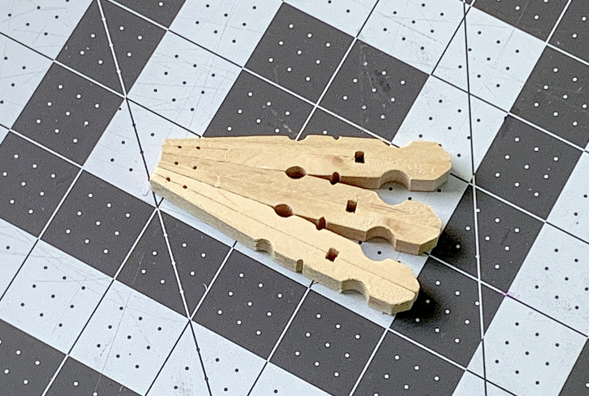 Three clothespins glued together
