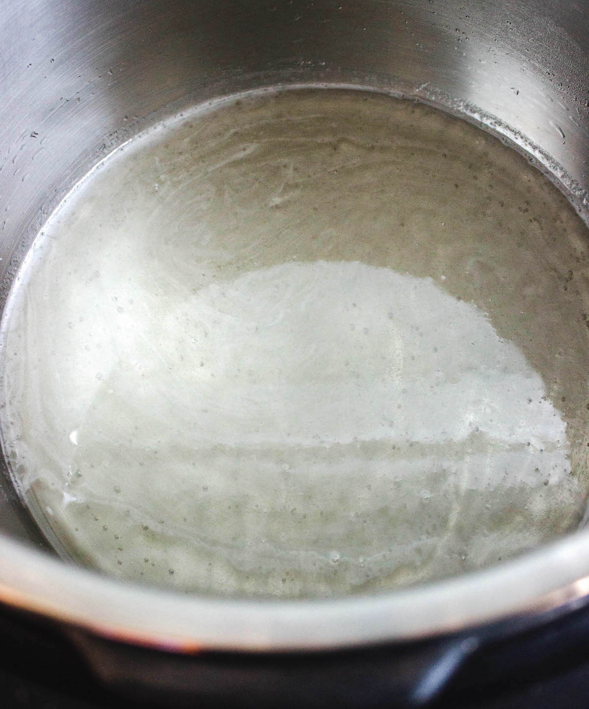 Water and sugar heating up in an Instant Pot