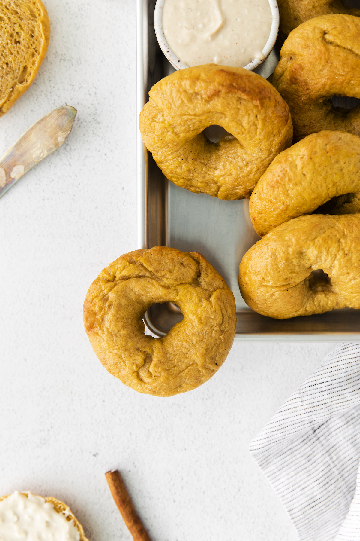 plate of pumpkin bagels with maple cream cheese