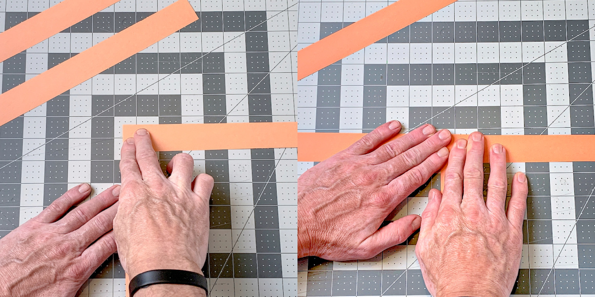Attaching strips of orange paper together with Glue Dots