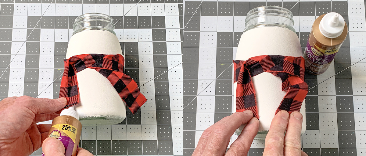 Gluing the bottom of the scarf down to the snowman mason jar