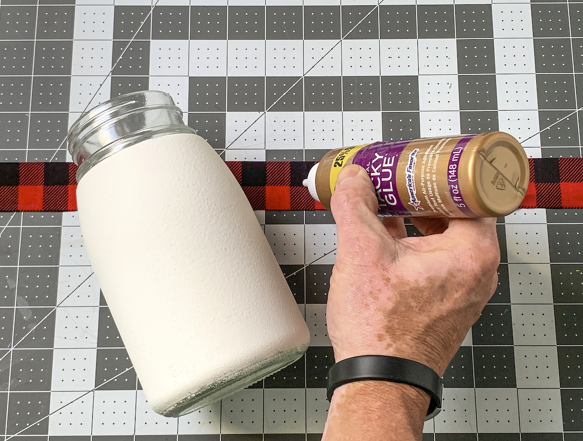 Placing glue on the back of the buffalo plaid scarf