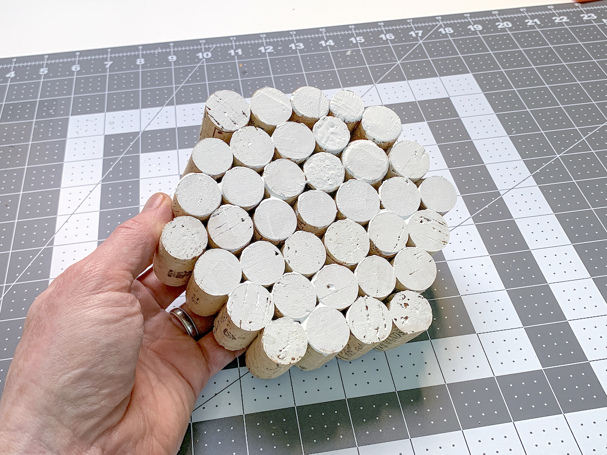 Stack of corks glued together and painted white