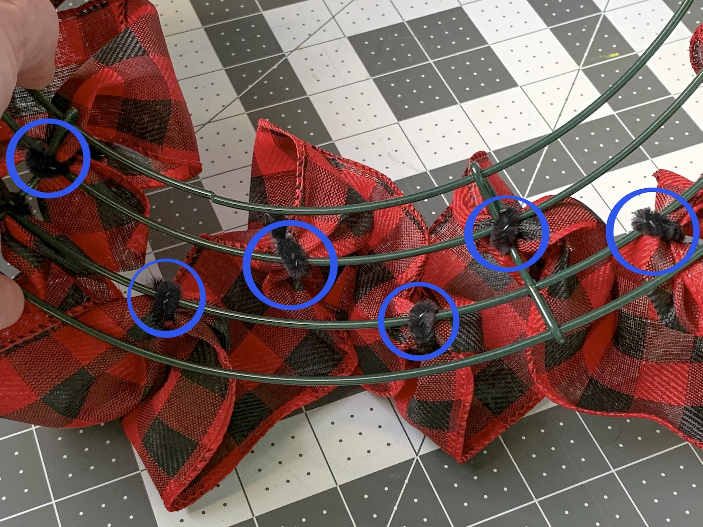 Pipe cleaner attachment points with blue circles