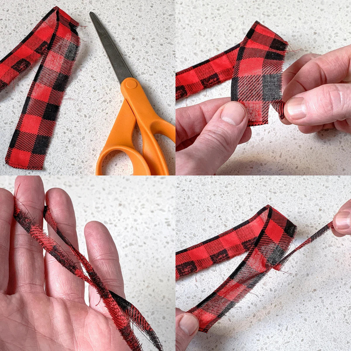 Cutting and ripping a piece of fabric for a scarf on an ornament