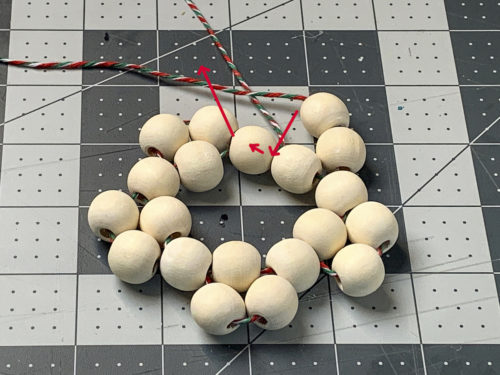 Diagram showing how to string the wood beads to create a star point