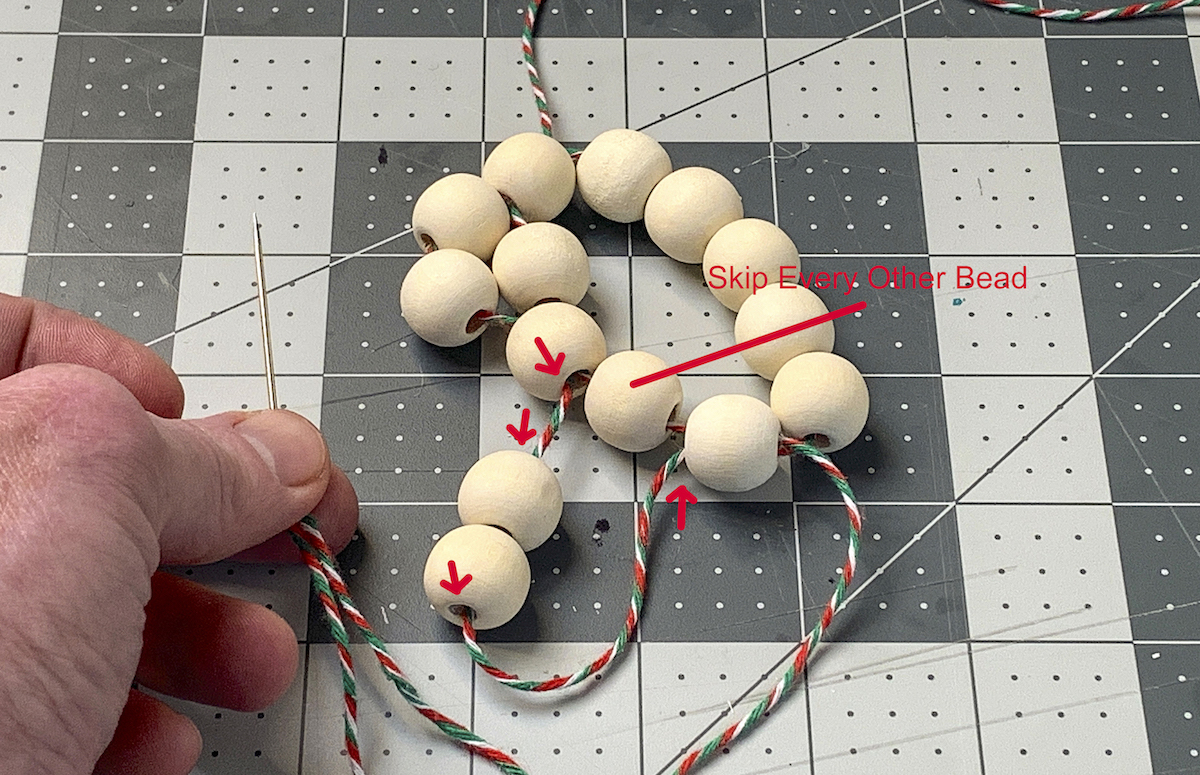 Stringing two beads onto the beaded circle