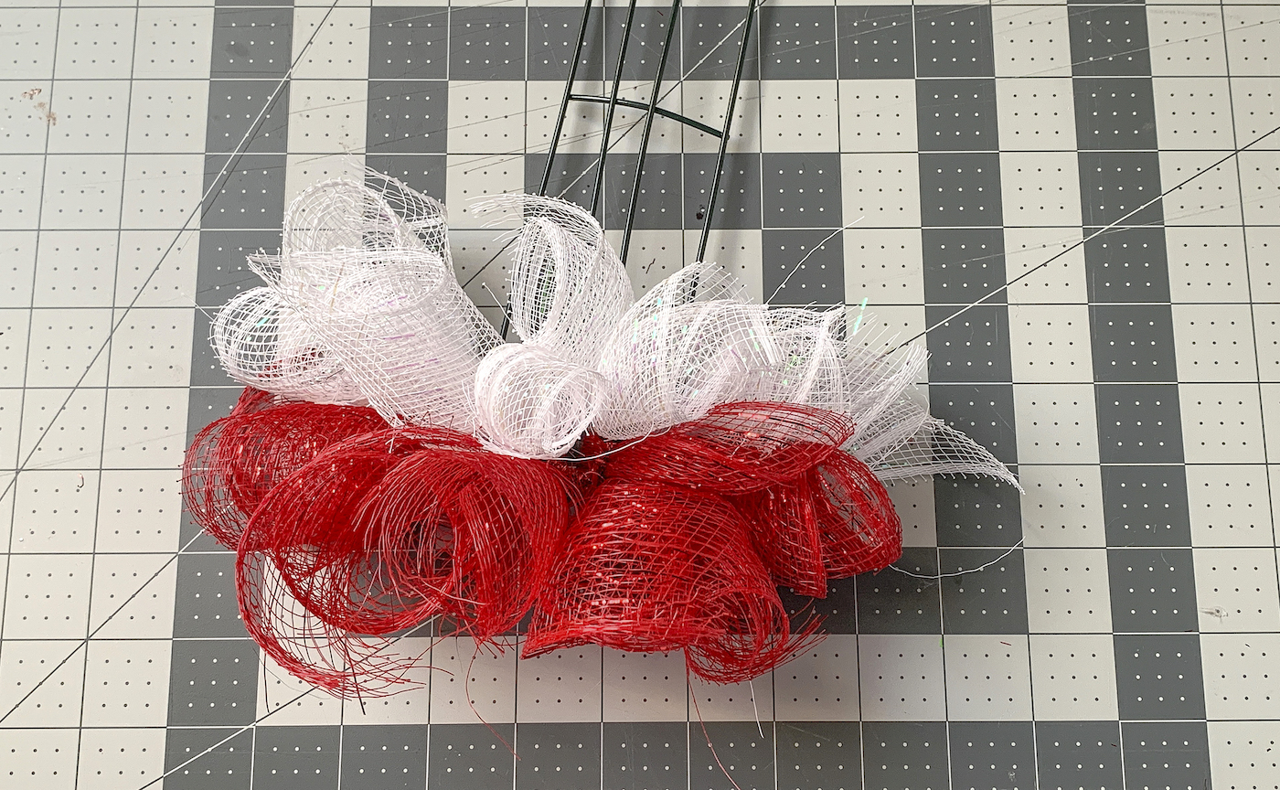 Two rows of red and white mesh attached to the candy cane deco mesh wreath