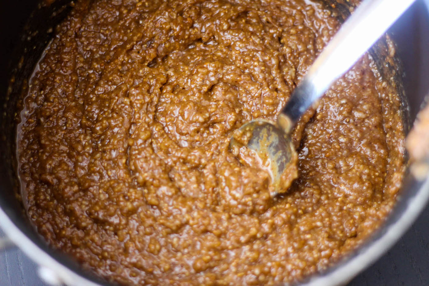 Stirring almond butter into the energy bar recipe