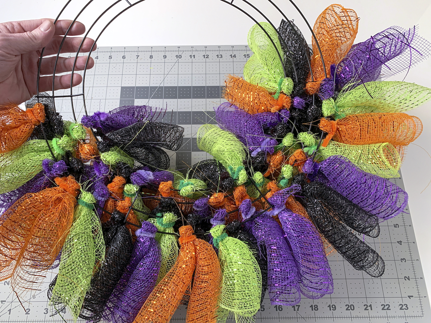 Back of a deco mesh wreath for Halloween