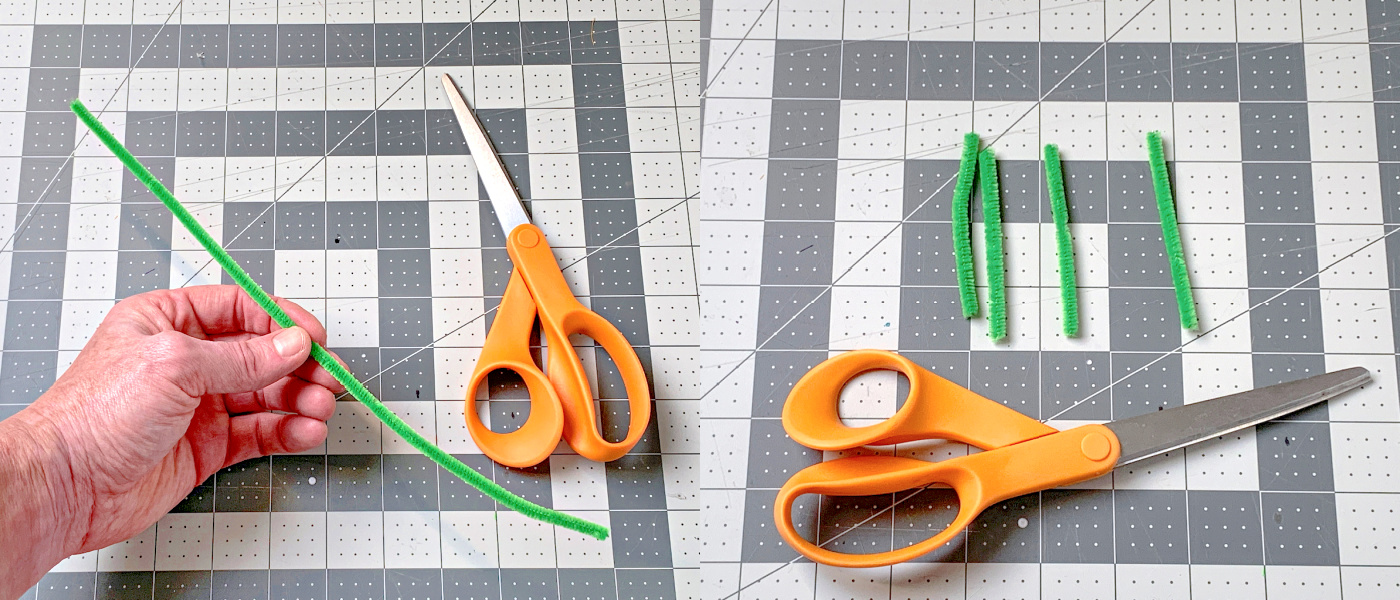 Green pipe cleaner cut into four pieces