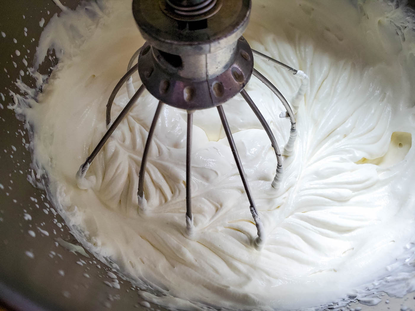 Beating the condensed milk and whipping cream mixture