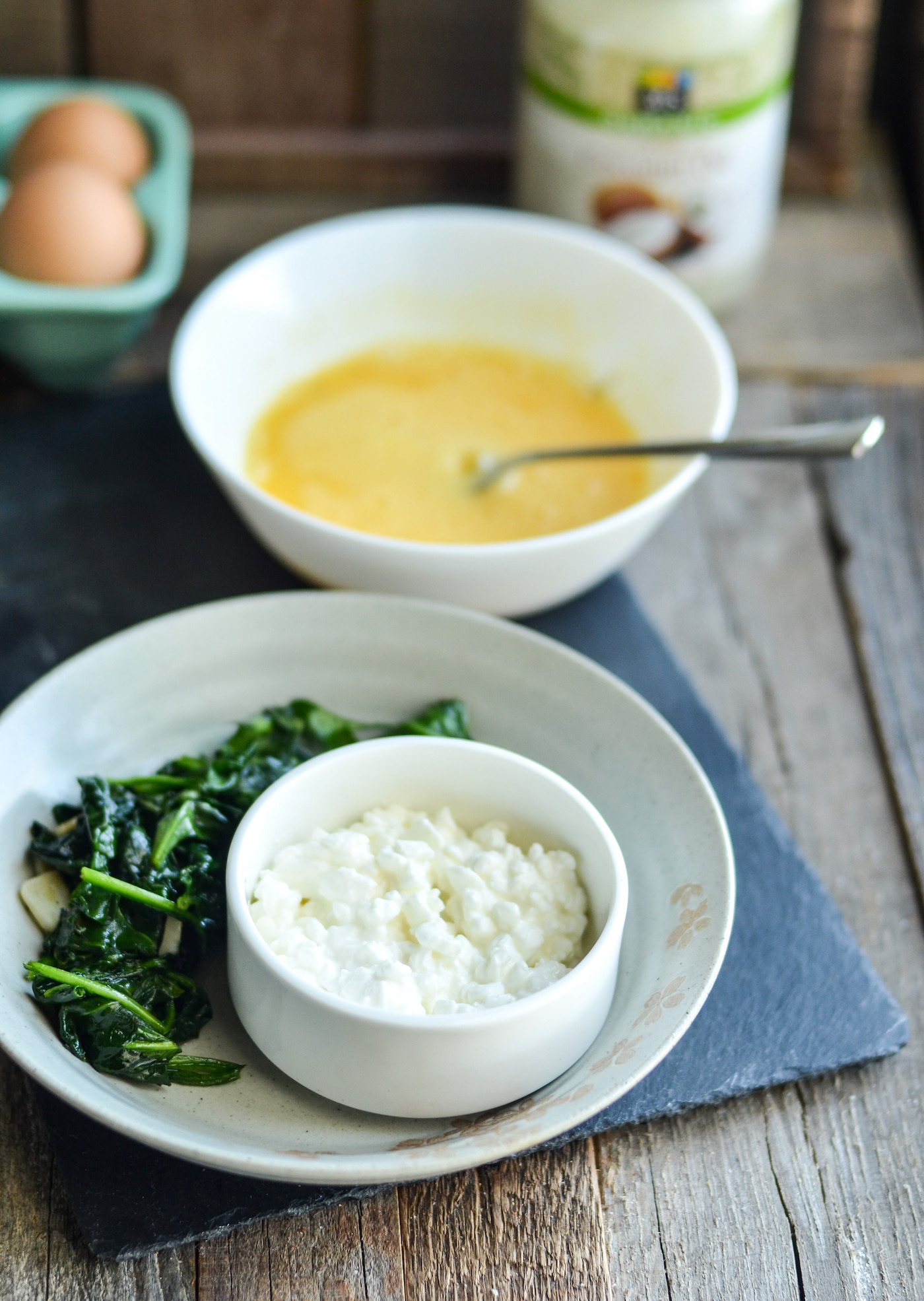 Cottage cheese, whisked eggs, and wilted spinach