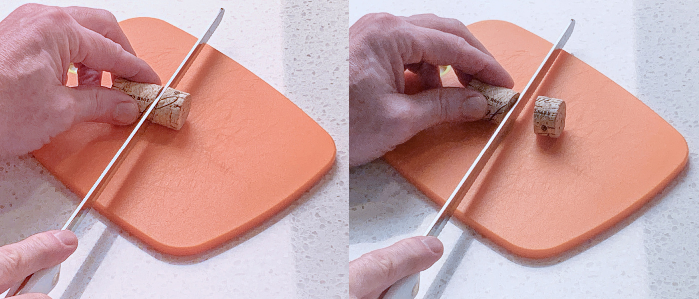 Slicing a wine cork with a knife on an orange cutting board