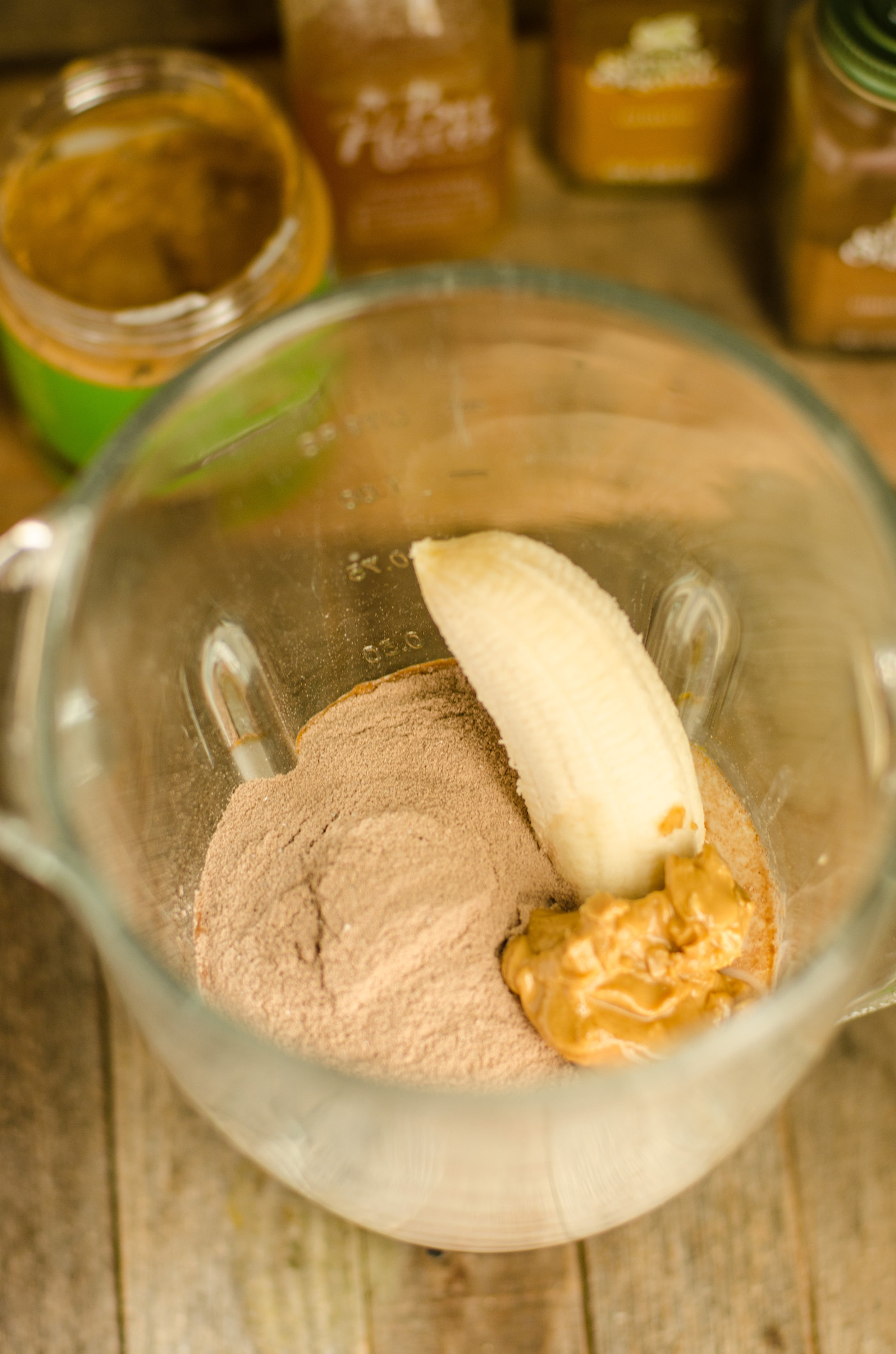 Banana, protein powder, and peanut butter in a blender