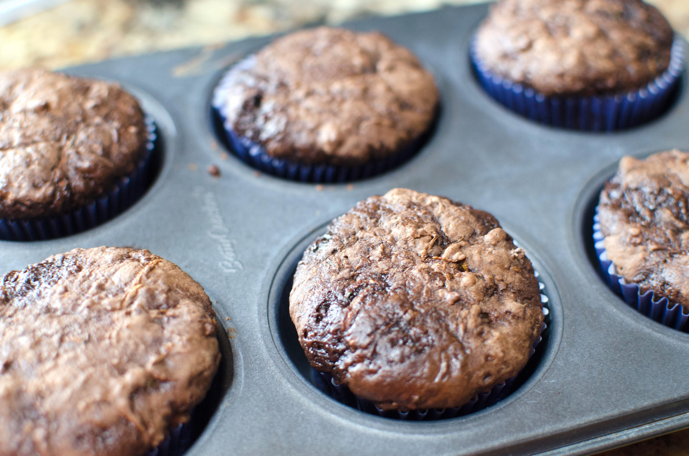 Chocolate zucchini cupcakes baked in a metal tin
