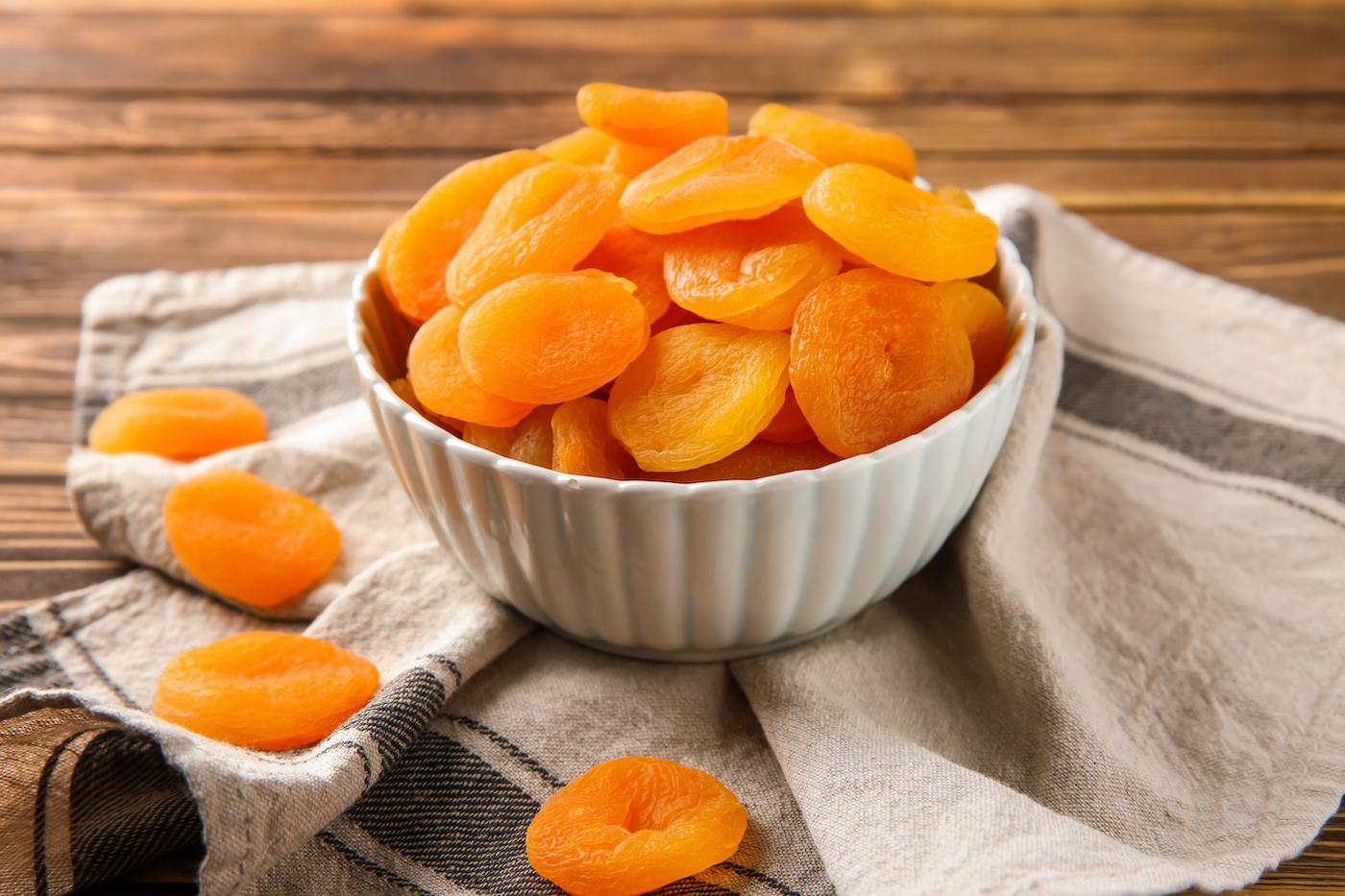 Bowl of dried apricots on a table