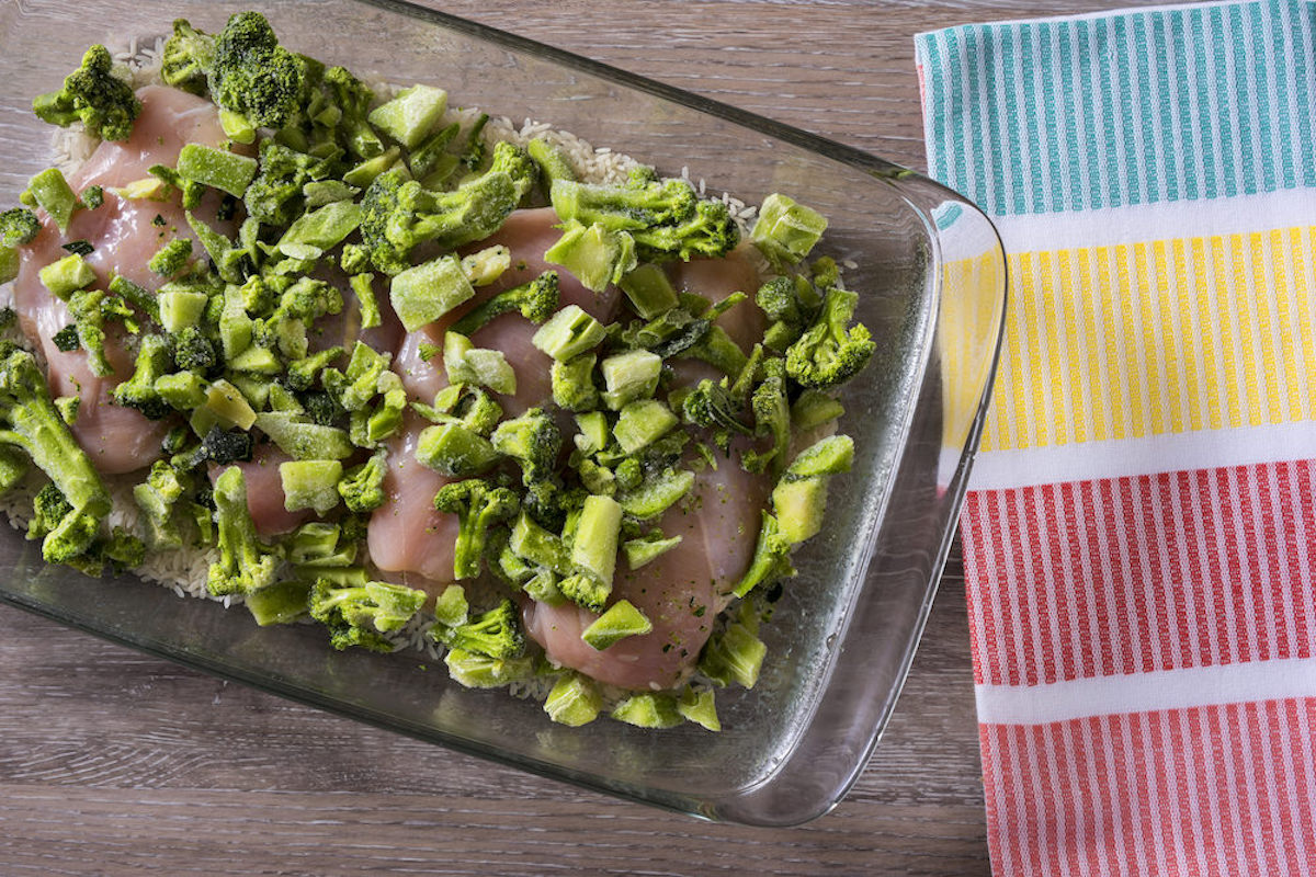 Broccoli spread over chicken breast in a casserole dish