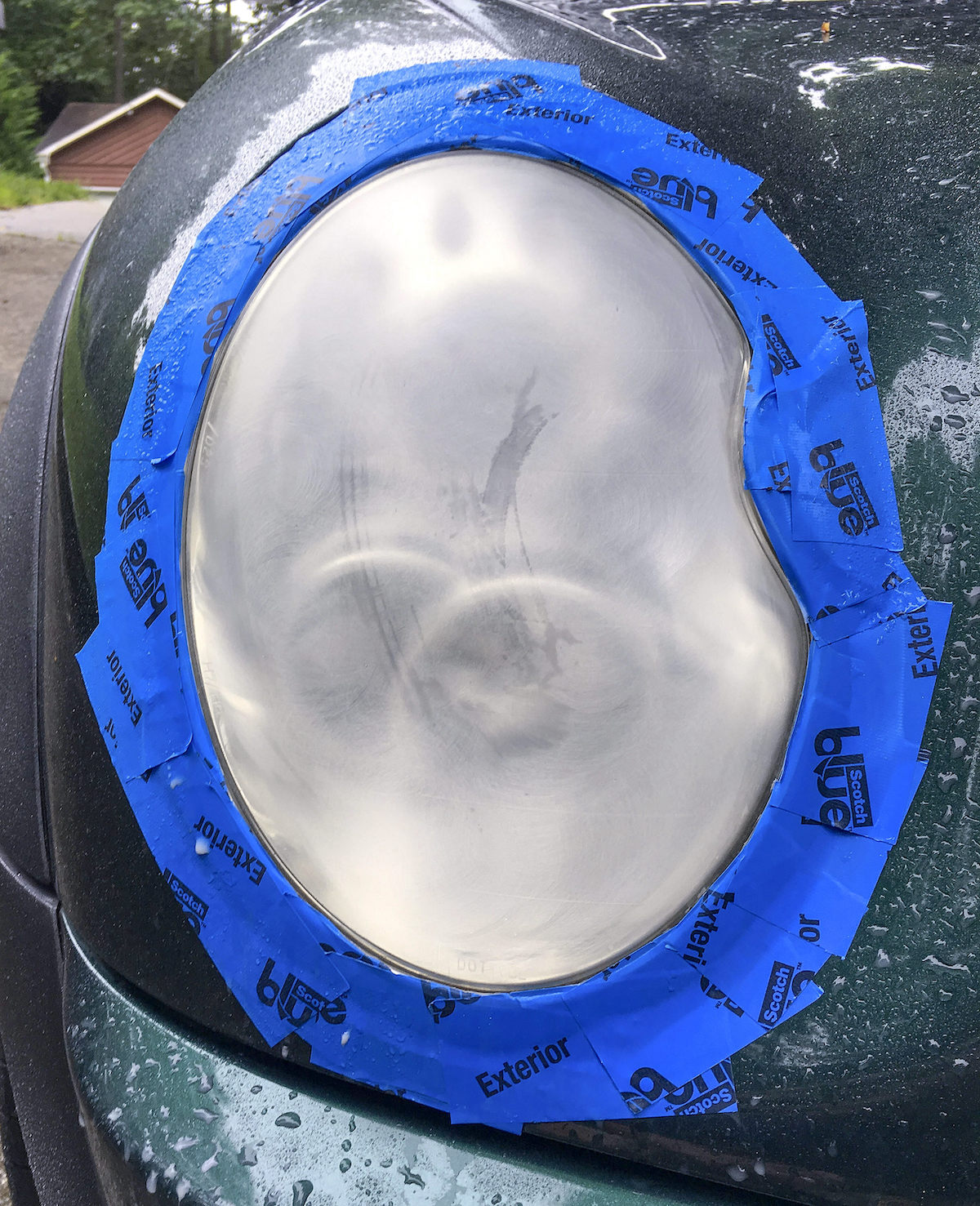 Headlight sprayed with water after initial dirt removal