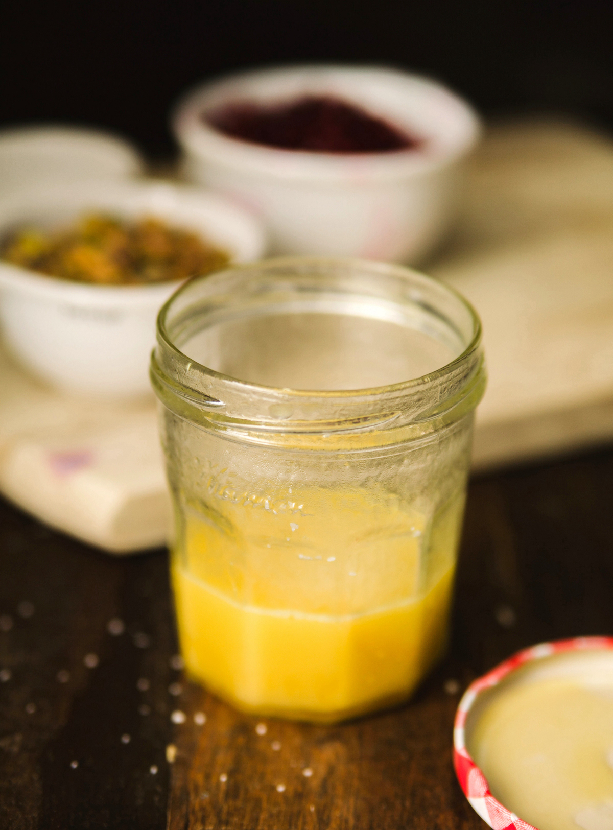 Lemon juice, olive oil, and honey in a glass jar